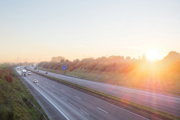 Highway transportation traffic at sunrise. Germany