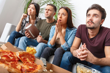Group of friends sport fans watching rugby match worry