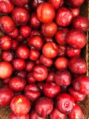 Juicy red tasty plum on the market 