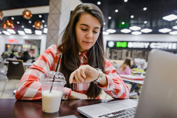 woman work in cafe on laptop
