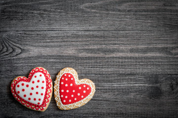 Gingerbread heart cookies on a rustic wooden background. Valentine's Day concpt. Free space copyspase for your text