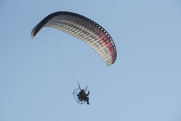 A paraglider in the sky