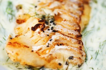 Roasted cod in dill sauce.