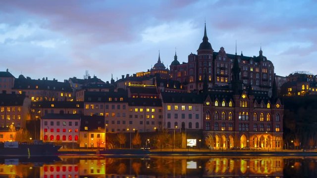 Time lapse of "Mariaberget" on Sodermalm in central Stockholm, Sweden. Mirror image in the lake.