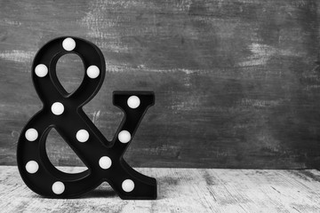 ampersand & sign on the background of a black board