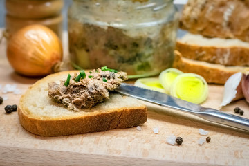 Bread with meat pate on wooden board
