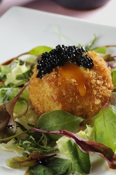 Breaded egg with caviar