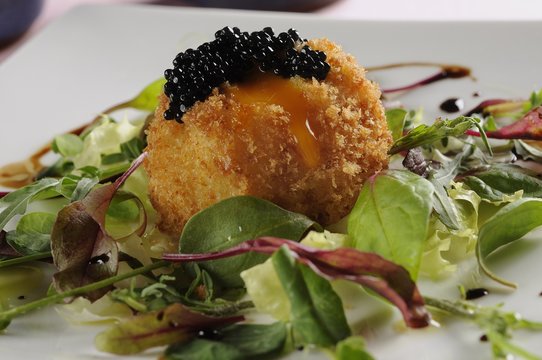 Breaded egg with caviar