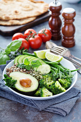 Green vegan lunch bowl with quinoa and avocado