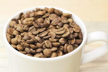 coffee beans on Roasted Coffee Beans and wood background