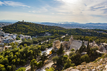 The Odeon of Herodes Atticus on the south slope of the Acropolis with the city of athens in the background