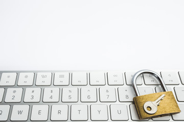 Background image of golden metal lock on keyboard