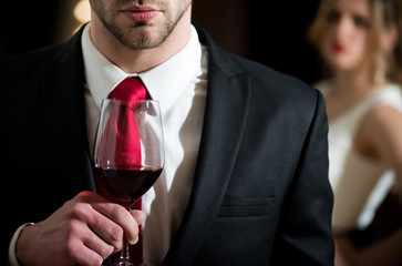 date and meeting, glass of wine in hand of man