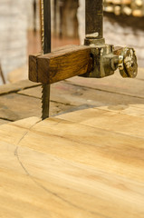 Carpentry saw on wood.