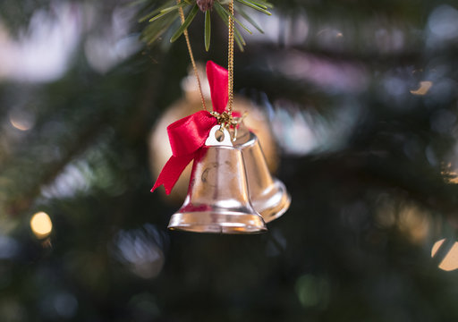 Christmas bells decoration hanging from a christmas tree