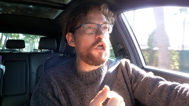 Man in car screaming f word angry with people driving like crazy