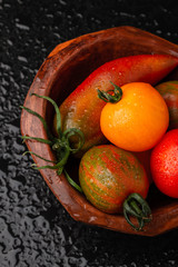 Organic tomatoes and pepper in a bowl