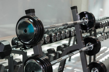 Steel Disks and Barbells in Gym: Weight Fitness Equipment
