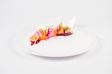 Smoked salmon with roasted beetroots sauce, russian pancakes and horseradish cream
