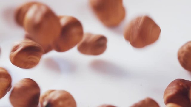 hazelnut falling in 180fps slow motion