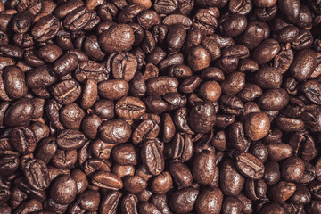 Background of  roasted coffee grains Food backdrop macro close-up