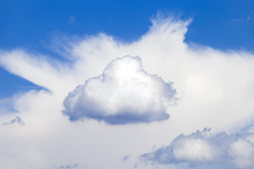 Cloud and blue sky background. Small cloud in the middle