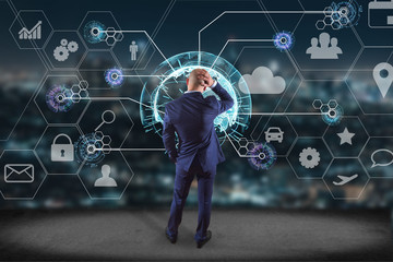 Businessman in front of a wall with an International business network connection displayed on a futuristic interface with technology icon and sphere globe - Worldwide business concept