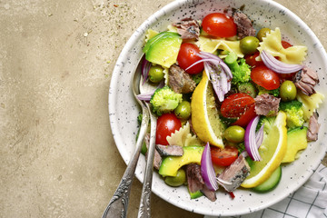 Tuna salad with pasta and vegetables.Top view with copy space.