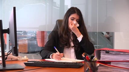 Good looking businesswoman young person blowing nose inside office accountant 4K