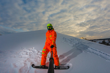 Snowboarder with the snowboard making a selfie