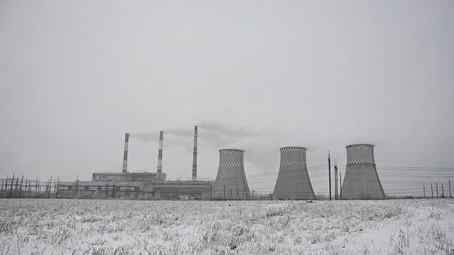 Power lines in the snow. Cogeneration plant in a strong blizzard