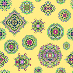 Vector seamless pattern from mandalas on yellow background