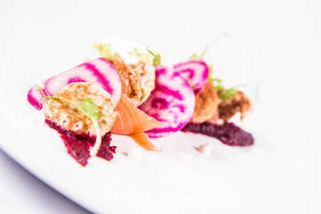 Smoked salmon with roasted beetroots sauce, russian pancakes and horseradish cream