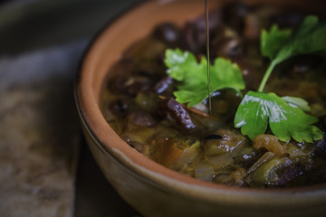 A close up color studio image of Egyptian Traditional food (Fava Beans) A.K.A (Foul) - Also served in Lebanon, Syria and most of Arabian countries specially middle eastern countries.