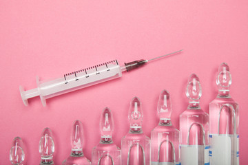 Increasing dependence on injections of hyaluronic acid, botox and collagen. Syringe and ampoules on...