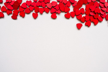 Valentines Day background with red hearts on white surface. Romantic seamless pattern for holiday, flat laz, top view