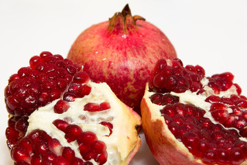 Purified pomegranate fruit on a white background