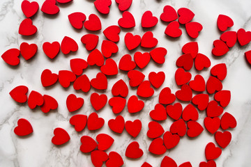 Valentines Day background with red hearts on white surface. Romantic seamless pattern for holiday, flat laz, top view