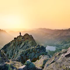 Photo sur Plexiglas Colline Man on the top of the hill in orange sunset light