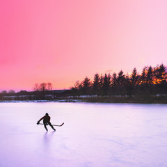 hockey player, natural ice, sunset light