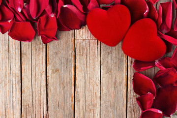 Valentines Day Background Red Hearts And Petals On Rustic Wooden Table Valentines Day Background Red Hearts And Petals On Rustic Wooden Table