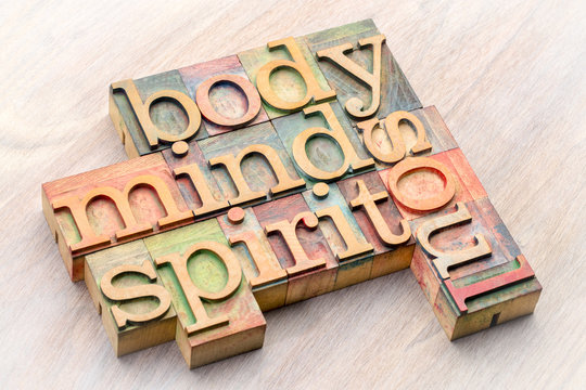 body, mind, spirit and soul word abstract in wood type