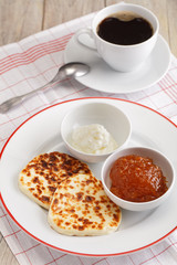 Cheese, cloudberry jam, and coffee