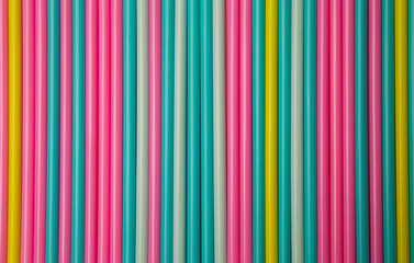 Background of colorful cocktail straws saturated pastel colors. 
