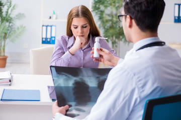 Doctor examining x-ray images of patient