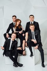 Mixed group of business men and women