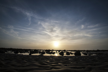 Fototapeta na wymiar Sunset looking over beach and pebbles