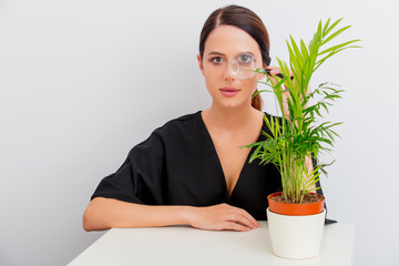 portrait of woman with palm in lagom style