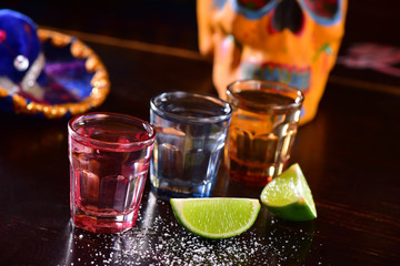 Tequila shoots on dark background