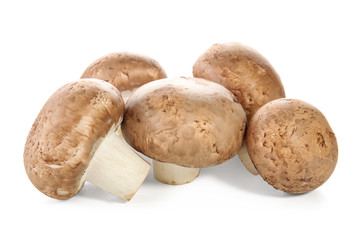 Raw cremini mushrooms on white background